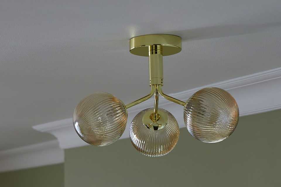 Champagne flush ceiling light with with 3 glass shades.