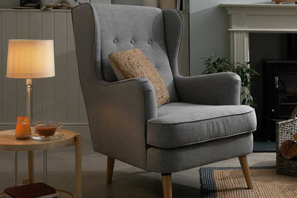 Wingback chair in grey fabric.