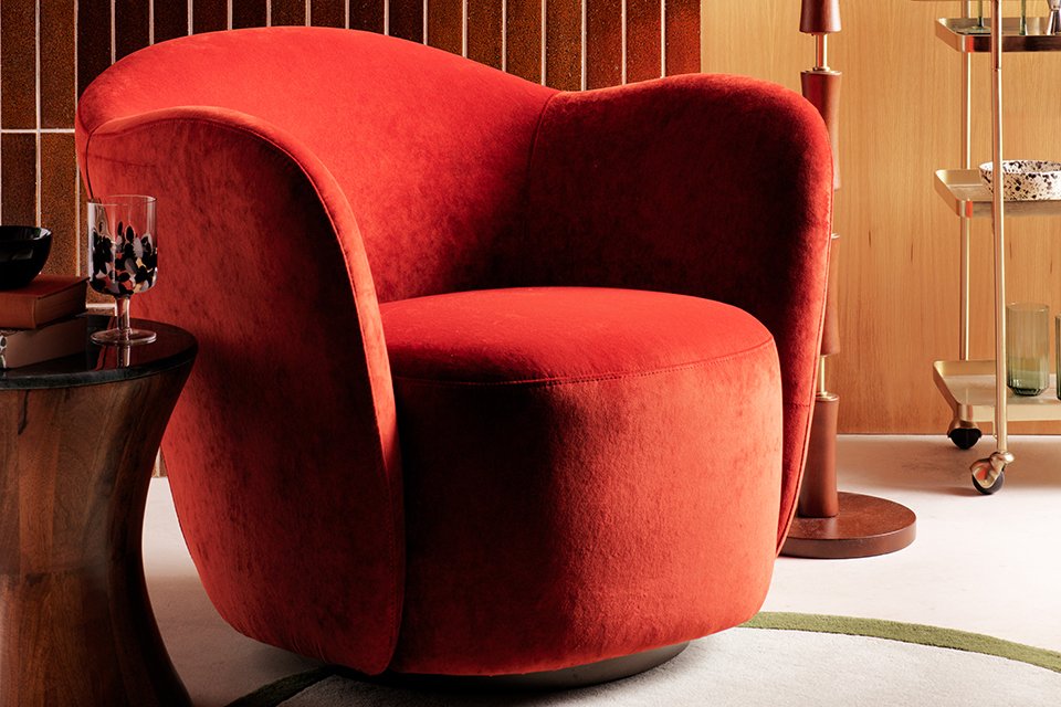 Orange velvet accent chair.