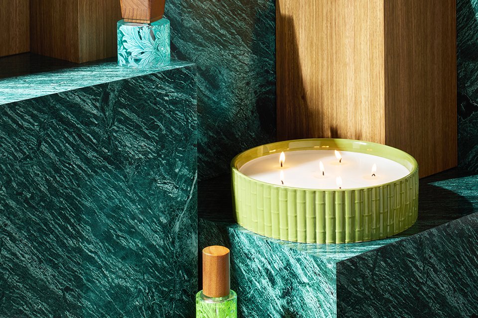 Morris & co candles and diffusers in blue bottles and green and blue ribbed candle jars.