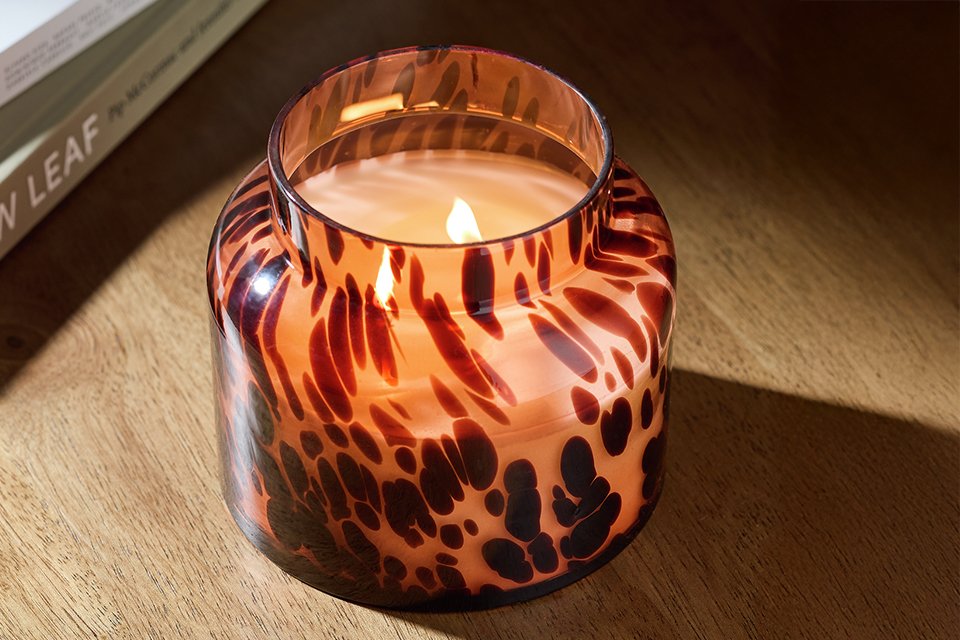 A Habitat confetti cedar and spice candle.