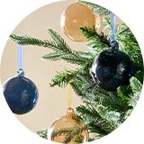 A Christmas tree decorated with a Habitat pack of 4 glass baubles.