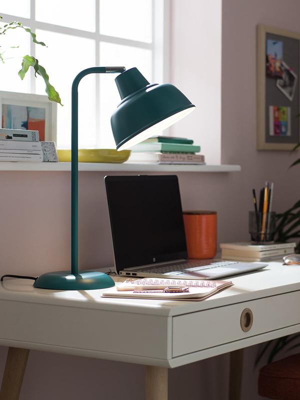 Desk lamp in workspace.