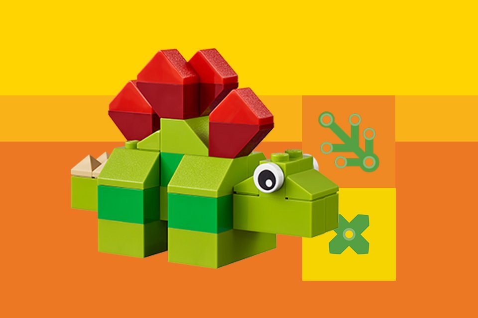 A LEGO® dinosaur build against yellow background.