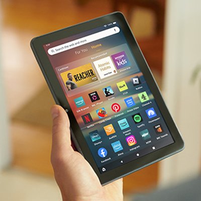 A person holding an Amazon Fire tablet. 