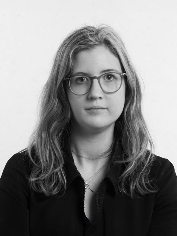 A black and white headshot of designer Molly.