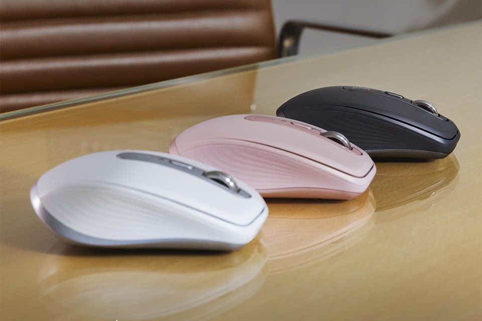 Three Logitech wireless mice in different colours.
