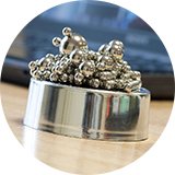 Menkind magnectic spheres in a bowl on a table.