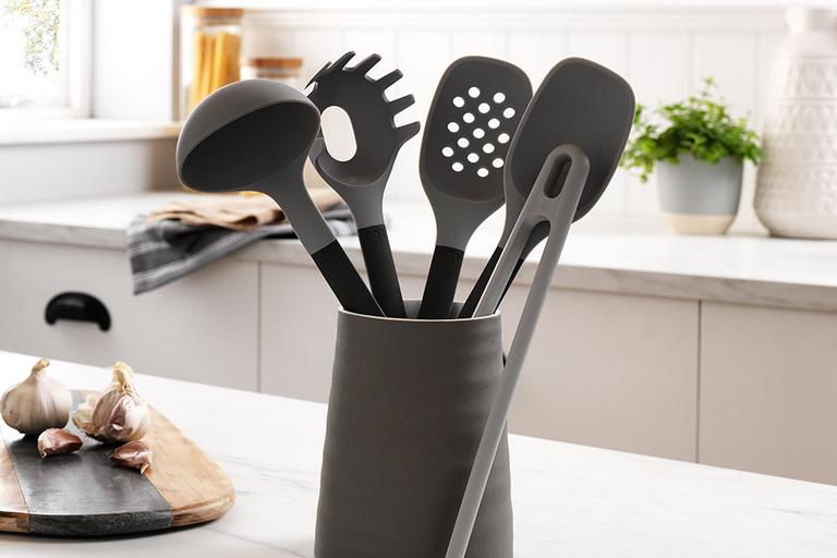 Image of some dark grey kitchen utensils.