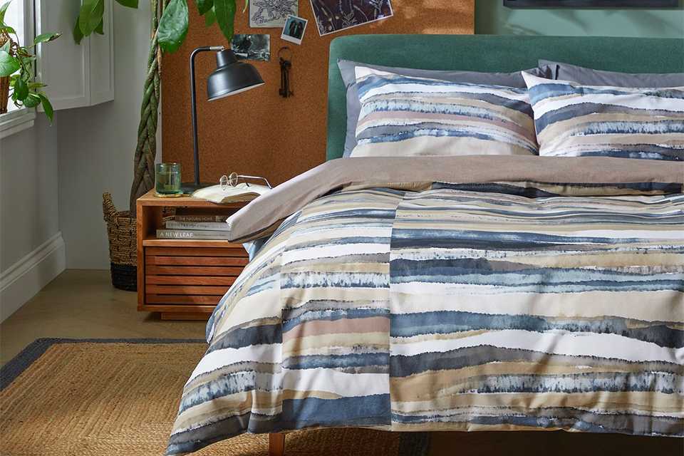 landscape inspired cotton double duvet set in navy and beige.