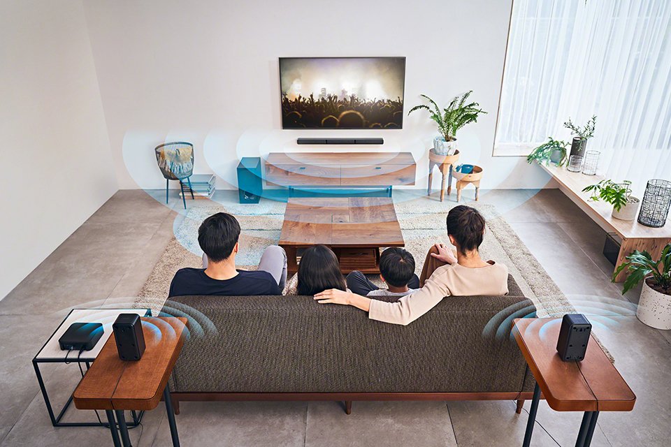 A family watching TV in a living room.