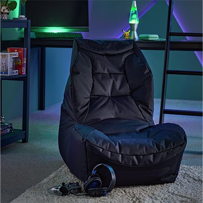 Gaming chair in gaming room with gaming set up.