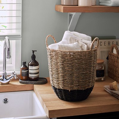 Woven basket on utility sink counter.