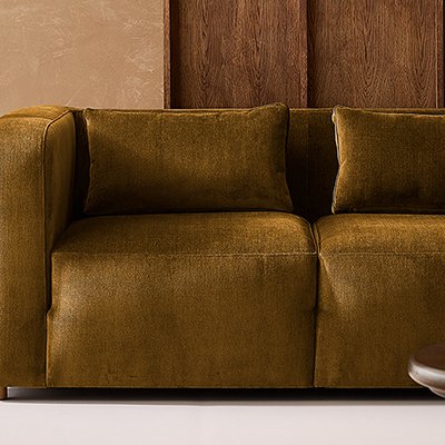 Brown velvet made to order sofa in living room with wooden accents.
