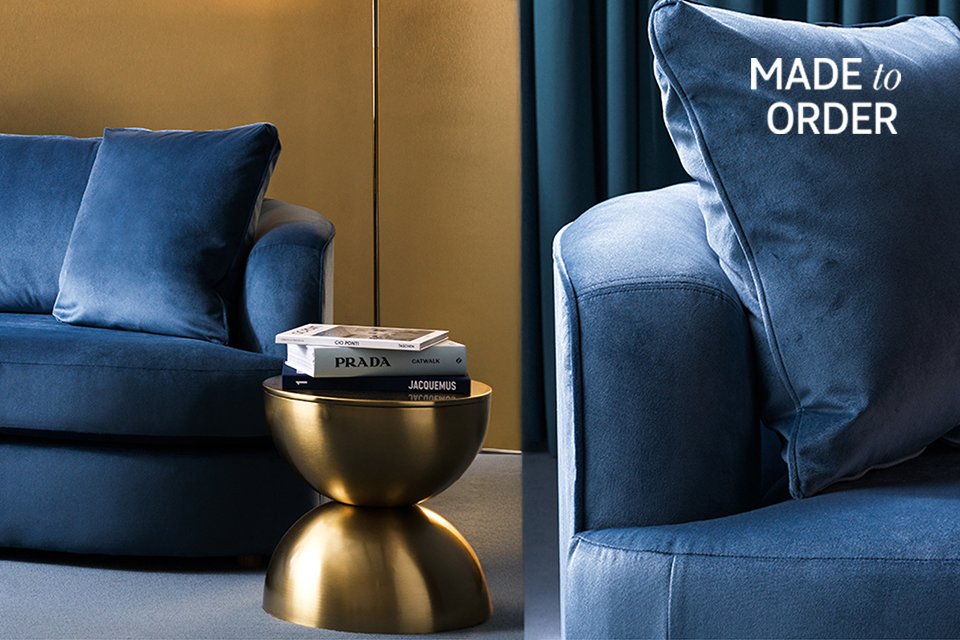 Blue velvet sofa in living room.