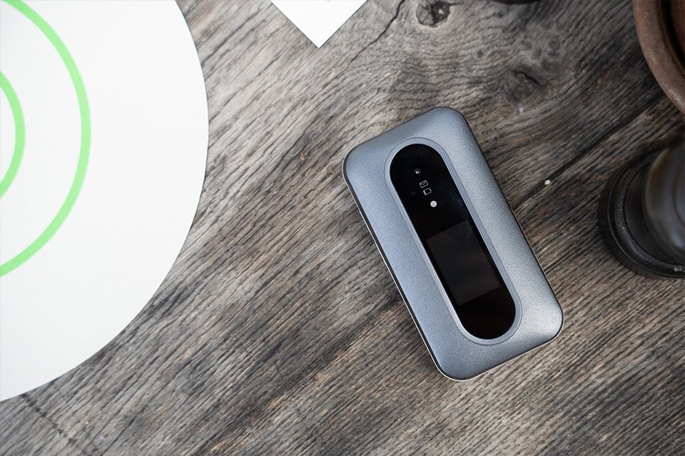 Doro Leva L30 clamshell feature phone placed on a wooden table.