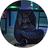 Gaming chair in gaming room with gaming set up.