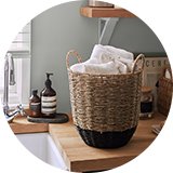 Woven basket on utility sink counter.