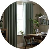 Green curtains in dining room.