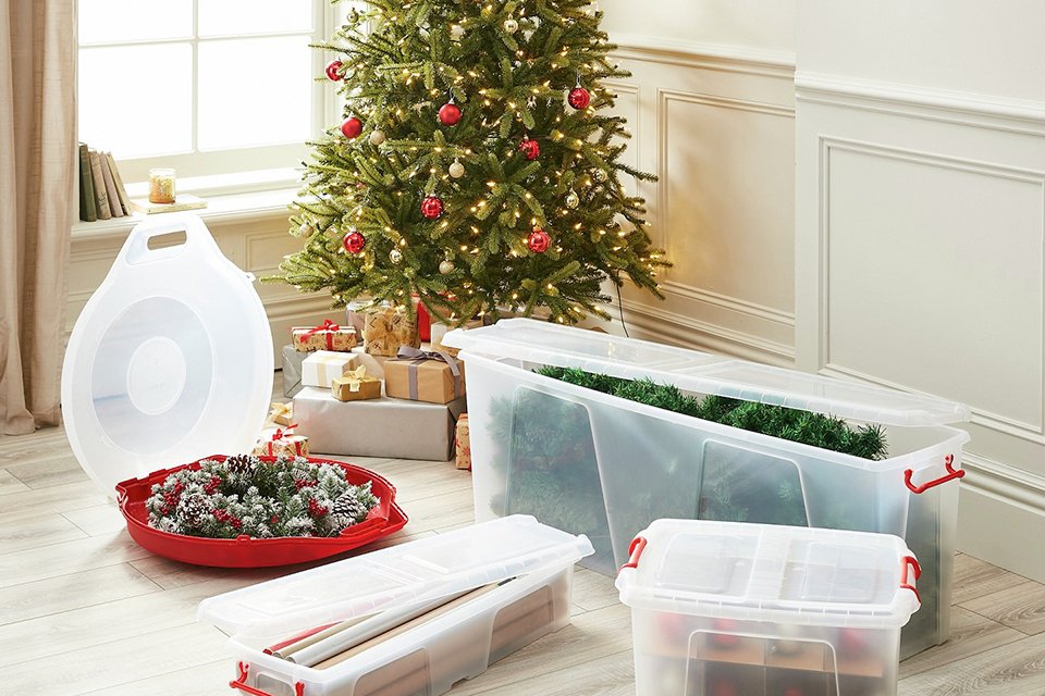 : A Strata Smart 120L storage box with a Christmas tree inside.