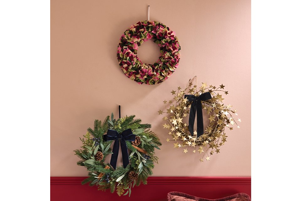 3 wreaths on a wall