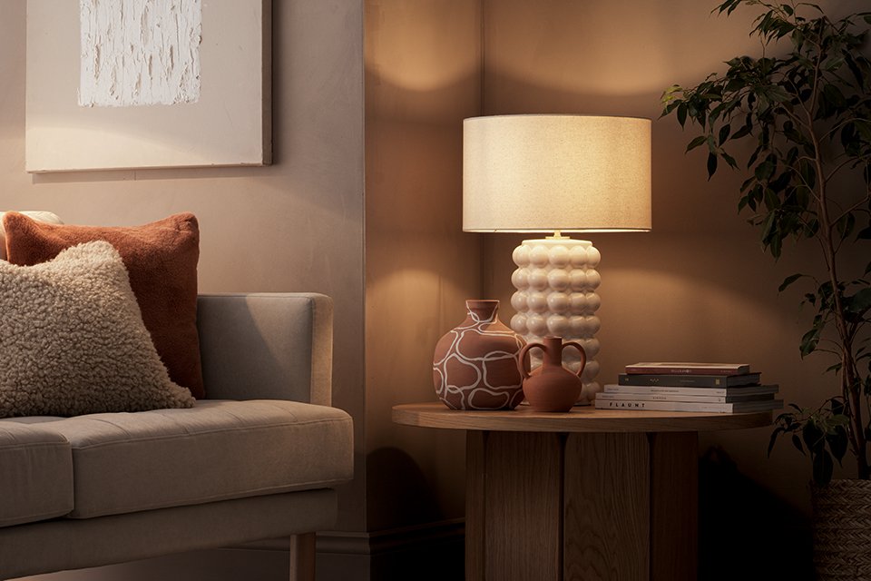 A table lamp on a side table.