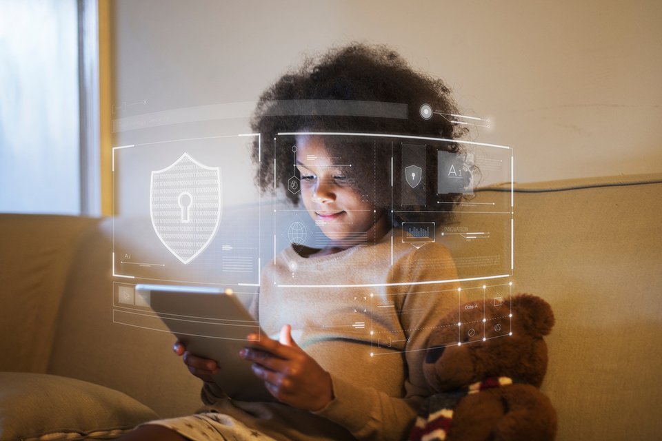 A boy using an ipad with online safety.