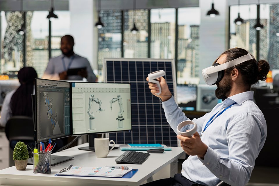 A man using VR headset for work in an office.