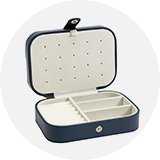 A dark blue jewellery storage box.