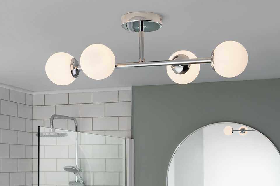 Chrome metal flush ceiling light with 4 glass shades.