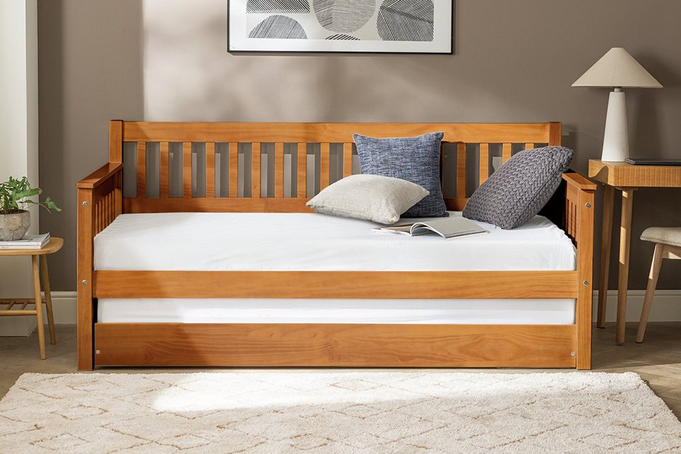 A Habitat Aspley trundle day bed in oak effect.