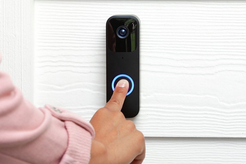 A white Blink Video Doorbell Wired or Battery + Sync Module.