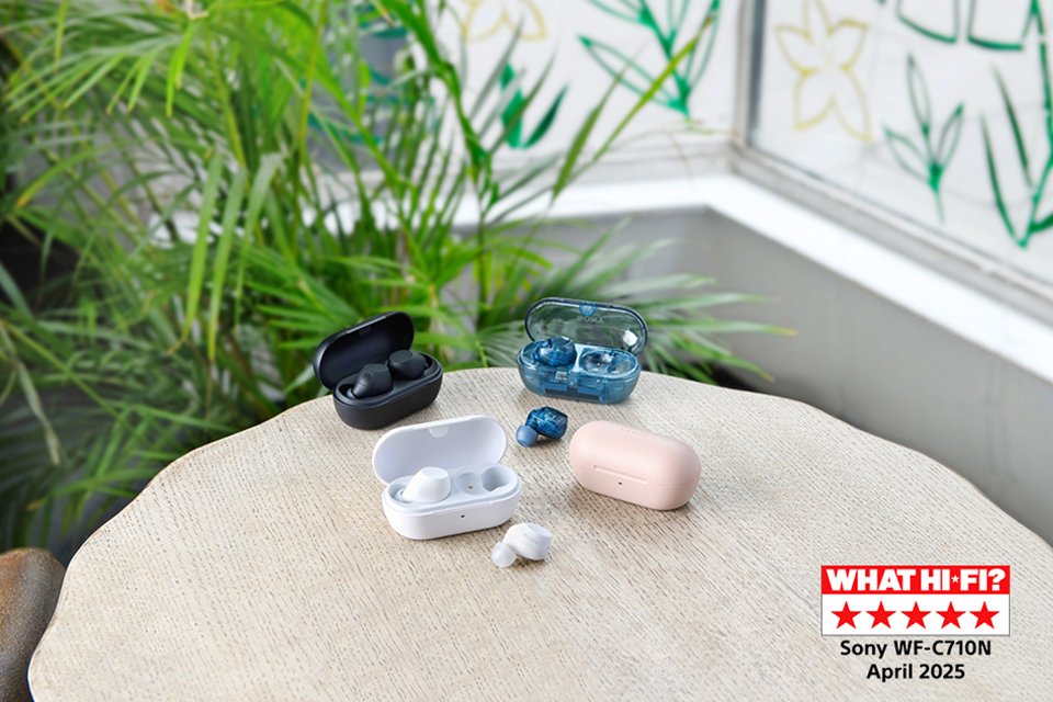 Several coloured Sony earbuds kept on a wooden table.