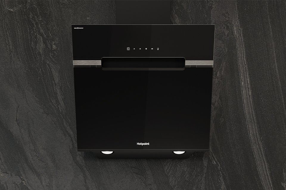 Hotpoint black cooker hood seamlessly built into modern grey kitchen wall.
