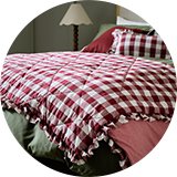 A 200x220cm Habitat Gingham Quilted Bedspread in berry.