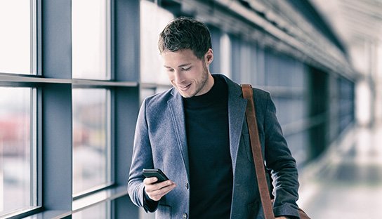 a picture of a man holding a payment card.