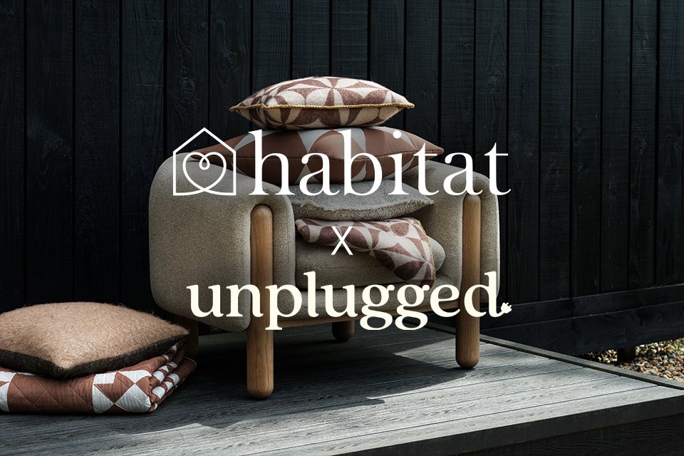 A banner for the Habitat x Unplugged collaboration with a cosy sofa and cushions.