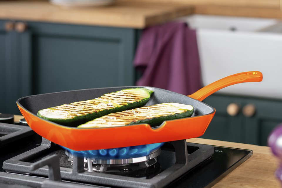 Habitat 23cm Cast Iron Griddle Pan in orange colour.