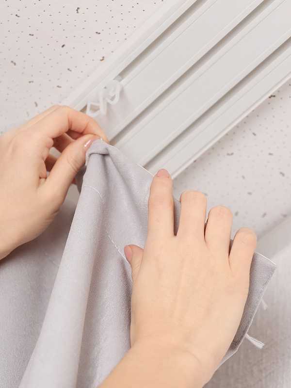 Clipping up curtains.