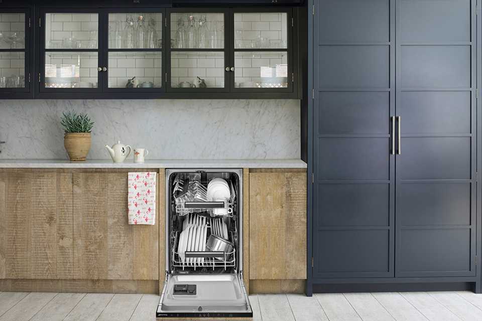 A Smeg dishwasher built into the kitchen counter.