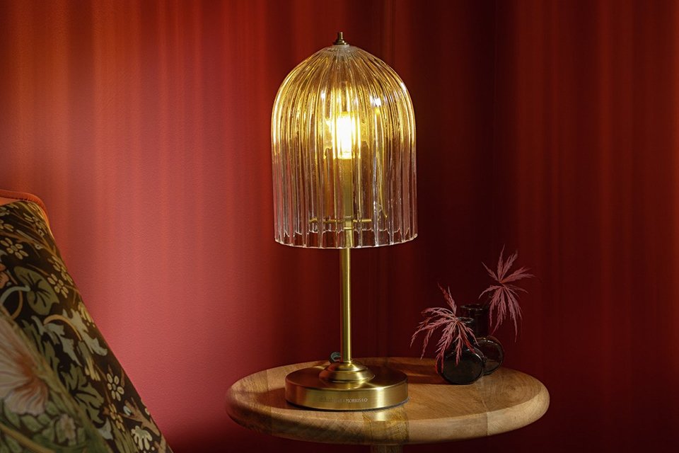 Habitat x Morris & Co. Glass & Brass Cloche Table Lamp on a side table.