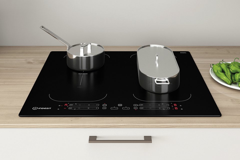 Food being cooked on a small and a large pan on Indesit IB 88B60 NE 60cm Induction Hob - Black.
