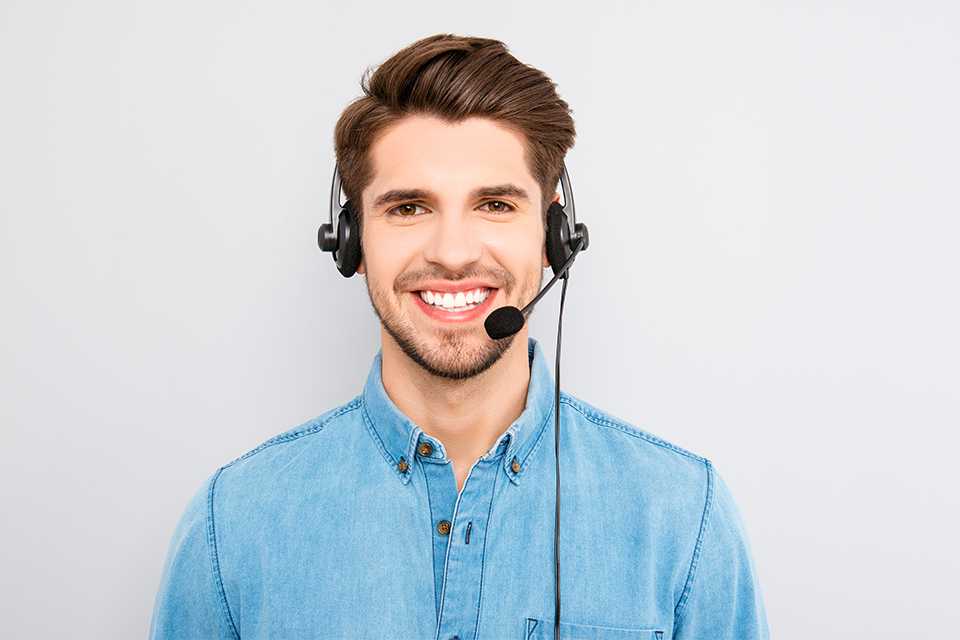A customer support executive wearing a headset.