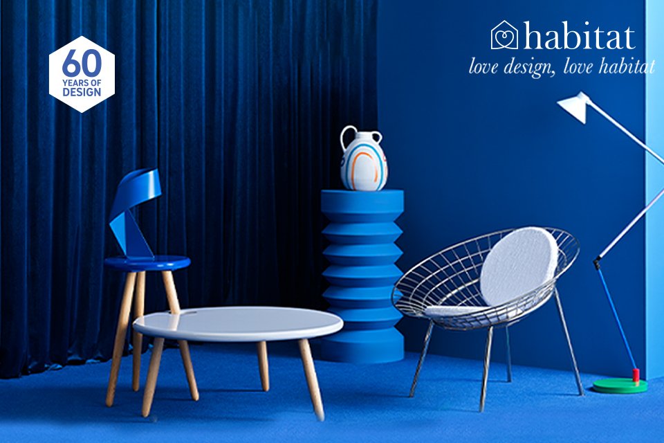 Habitat 60 years of design collaboraton collection presented in a blue room .