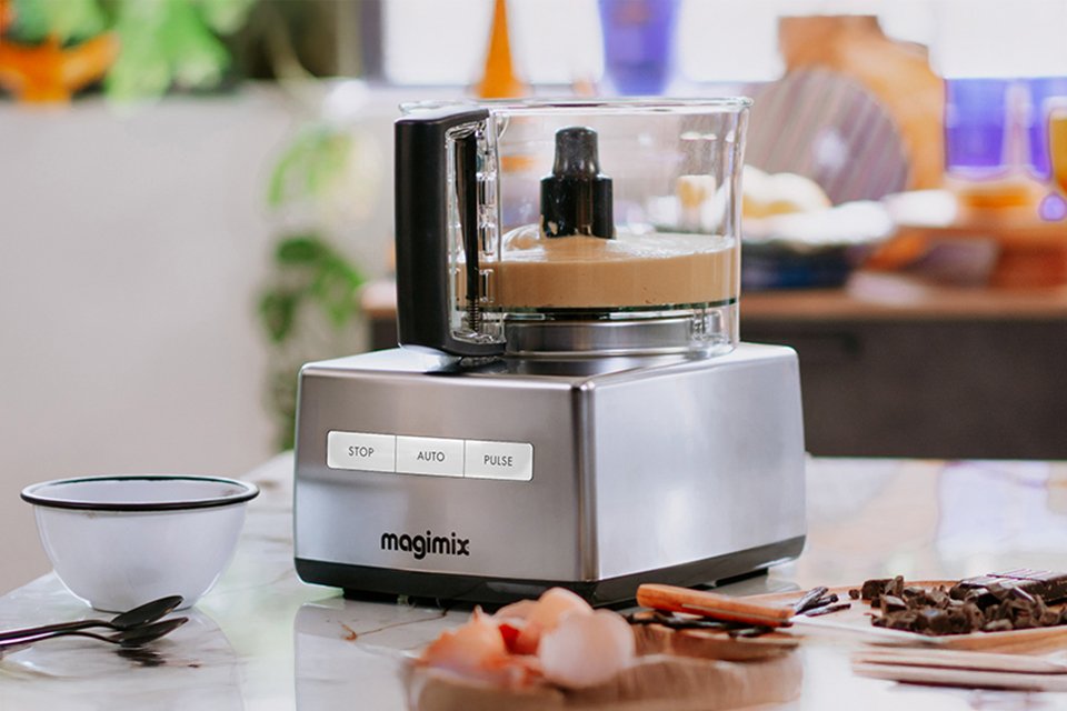 Quiet Mark certified Magimix 4200XL food processor blending ingredients on a kitchen counter.