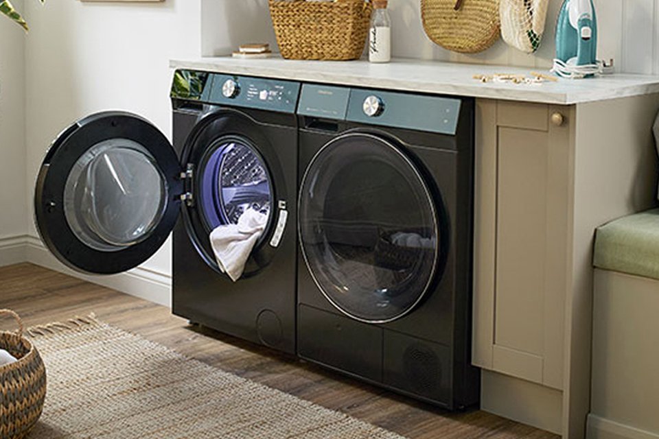 Quiet Mark certified Hisense tumble dryer set in modern laundry room. 
