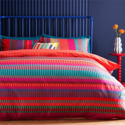 Colourful striped patterned bedding.