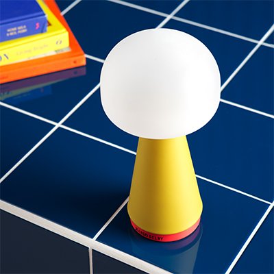 yellow table lamp with white circle shade.