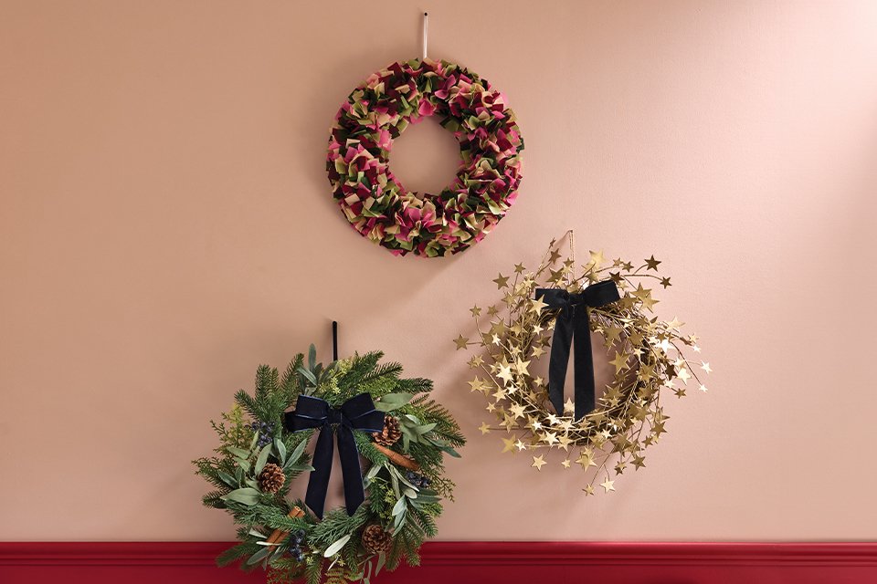 3 wreaths on a wall