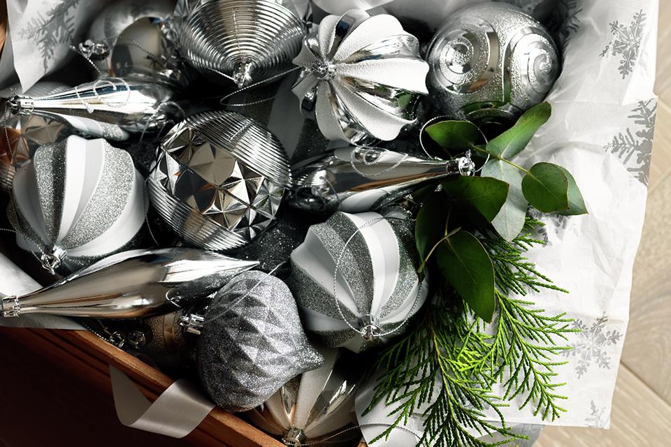 Image of a box of silver and white baubles.
